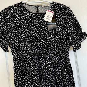 Black and white top fringe at the bottom and on the sleeves